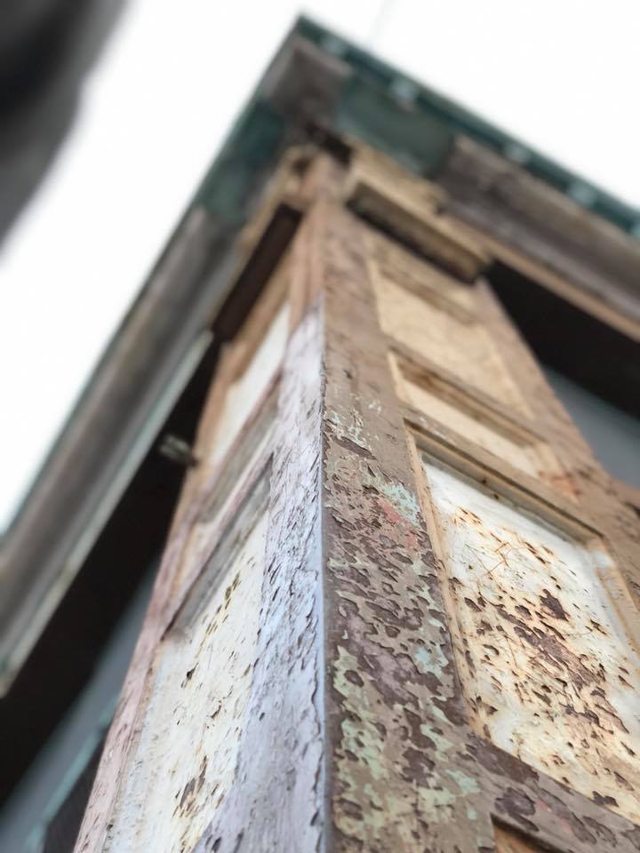 Weathered painted woodwork condition detail